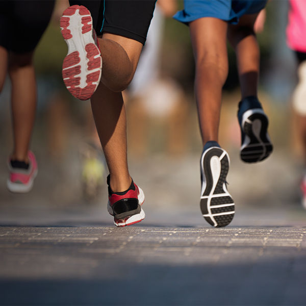 A detail of shoes running together