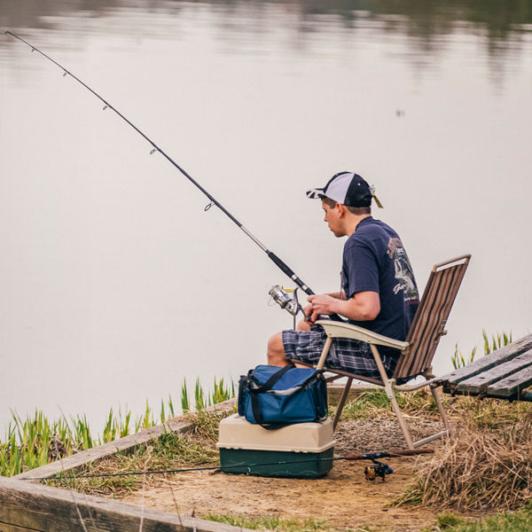 A boy is seen fishing in North Park Lake
