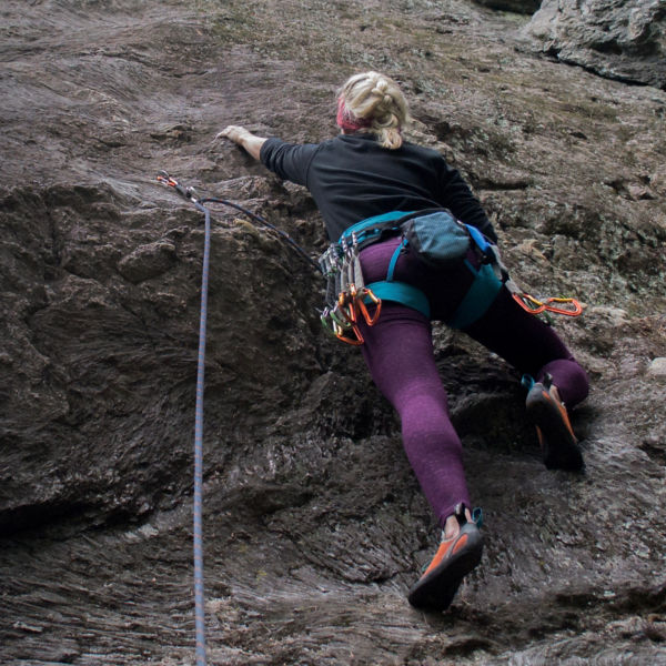Girl rock climbing at Rumney in New Hampshire