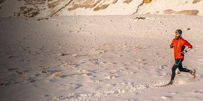 A man running in the Wasatch Mountains near Provo, UT in the winter