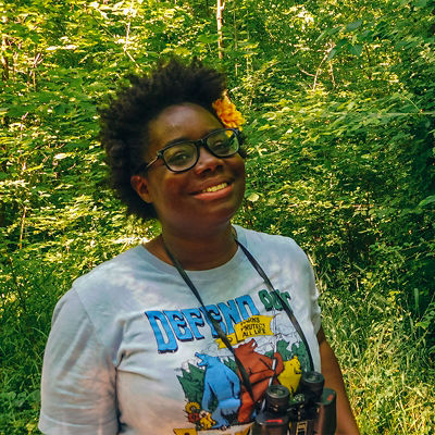 Nicole Jackson poses while birdwatching