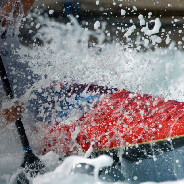 A kayaker races through the rappids.