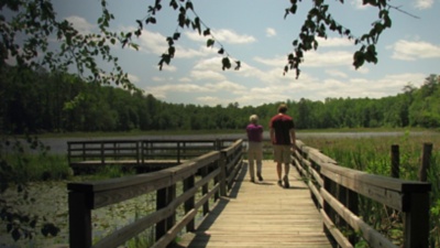 Two people walk at Pocahontas State Park 