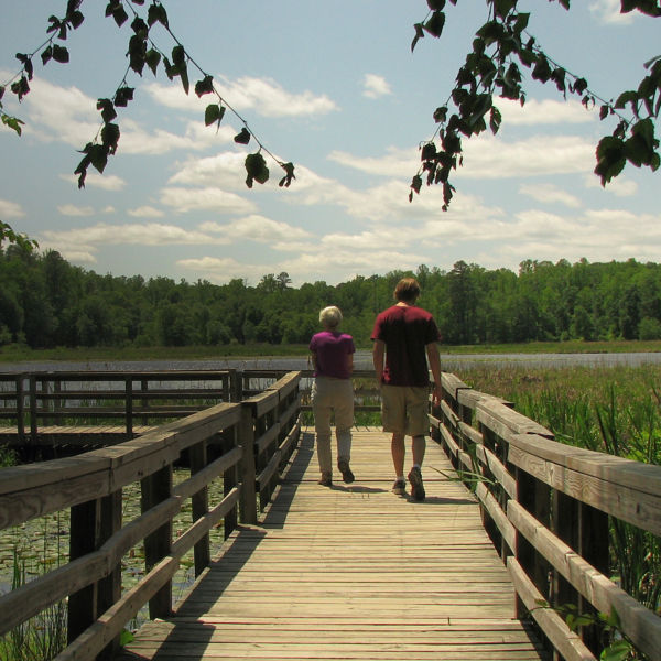 Two people walk at Pocahontas State Park 