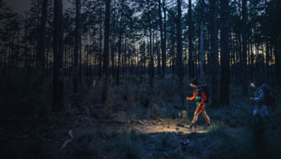 Two ultralight backpackers hike in the forest