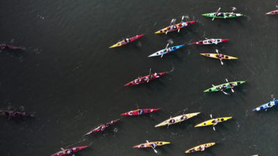 High Angle View Of People On Kayaks In River