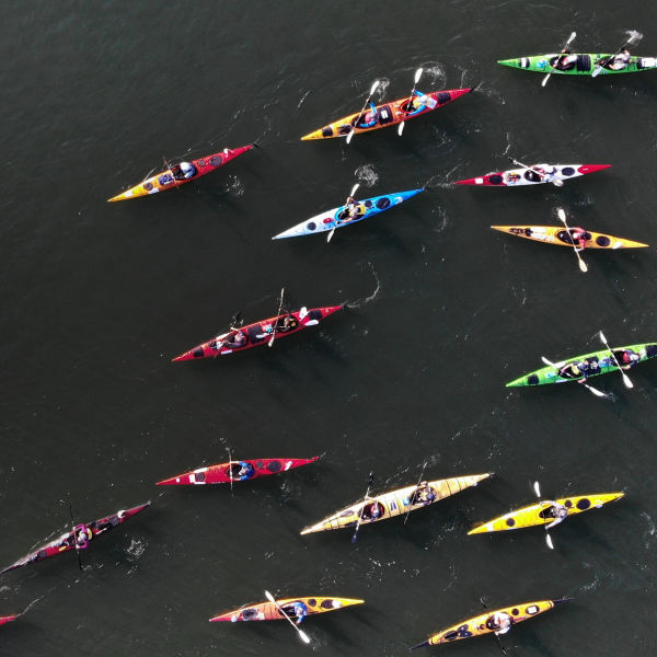 High Angle View Of People On Kayaks In River