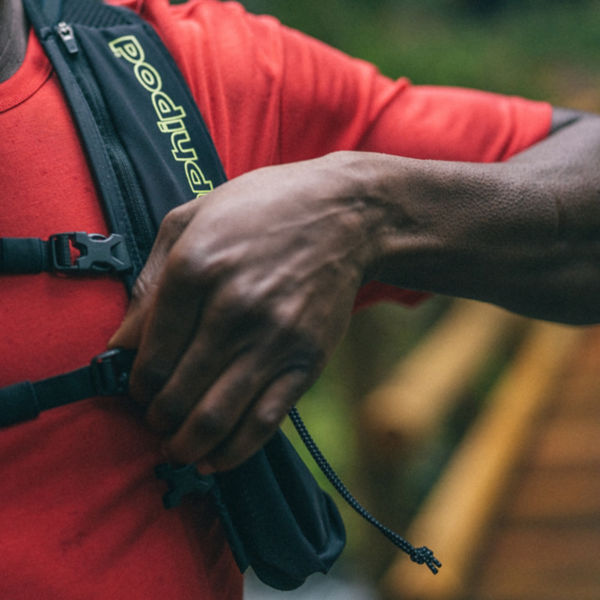A man adjusts his water bladder pack