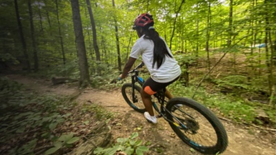 A mountain biker rides a trail in Alum Creek SP
