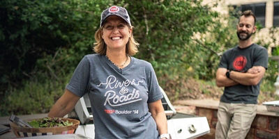 Kelly Bailey Newlon smiles next to food she has made