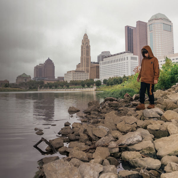 A young boy plays in the urban outdoors