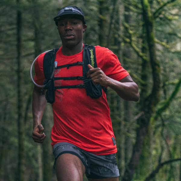 A man runs in the forest