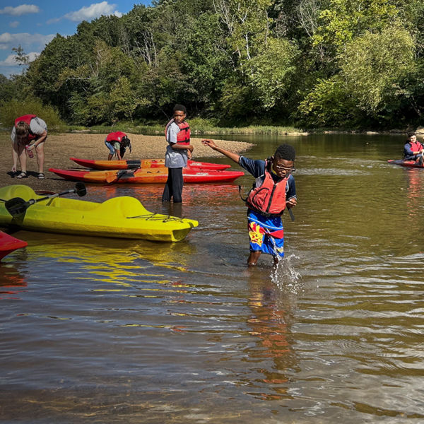 Kids kayak and play in the river with the Rivanna Conservation Alliance 
