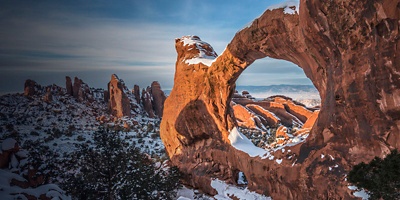  Double O Arch Snowy Sunset at Arches National Park