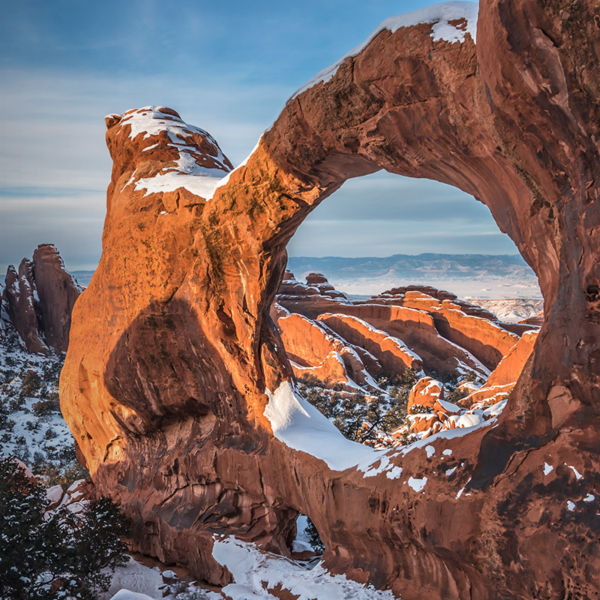  Double O Arch Snowy Sunset at Arches National Park