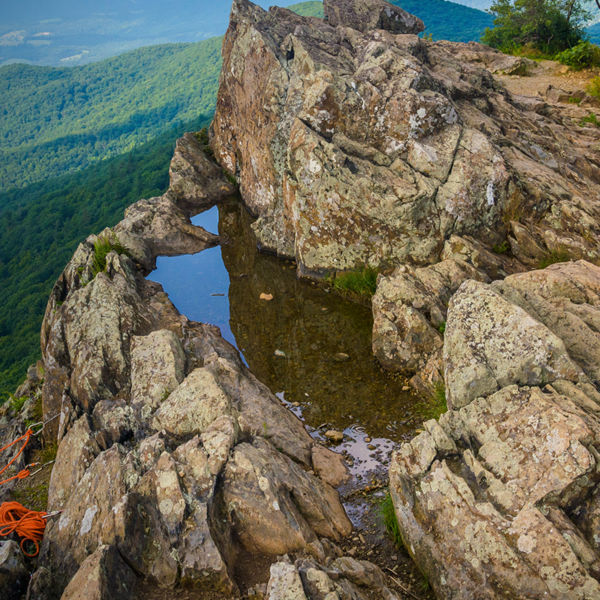 Rock climbing ropes attached to rocks on Little Stony Man Cliffs, in Shenandoah National Park, Virginia.