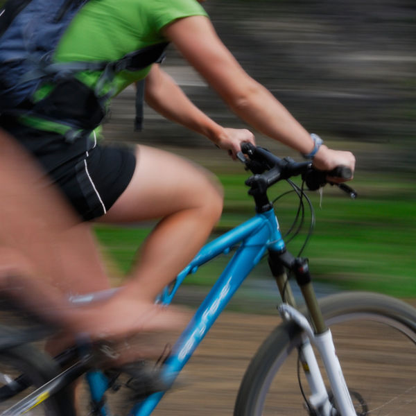 Two bikers blurred by speed