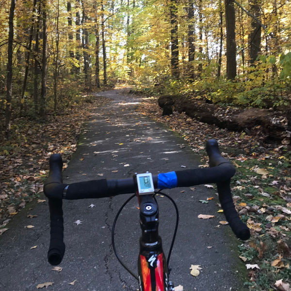 Bike handlebars are seen looking on the Columbus loop trail