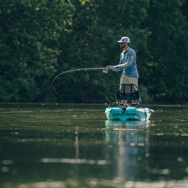 A man fishes from a kayak