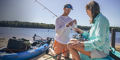 Two people prep to go fishing