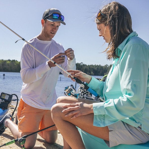Two people prep to go fishing