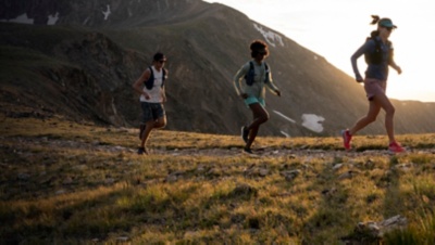 Clare Gallagher and two Patagonia athletes running in the Indian Peaks.