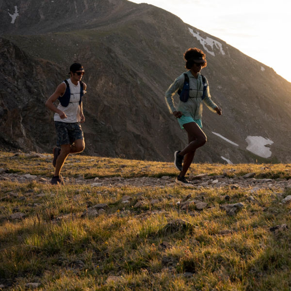 Clare Gallagher and two Patagonia athletes running in the Indian Peaks.