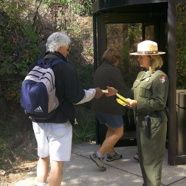 A ranger takes tickets at Wind Cave's walk-in entrance. Tours of Wind Cave are offered year-round.