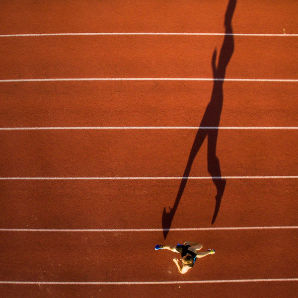 Shot of a young male athlete training on a track