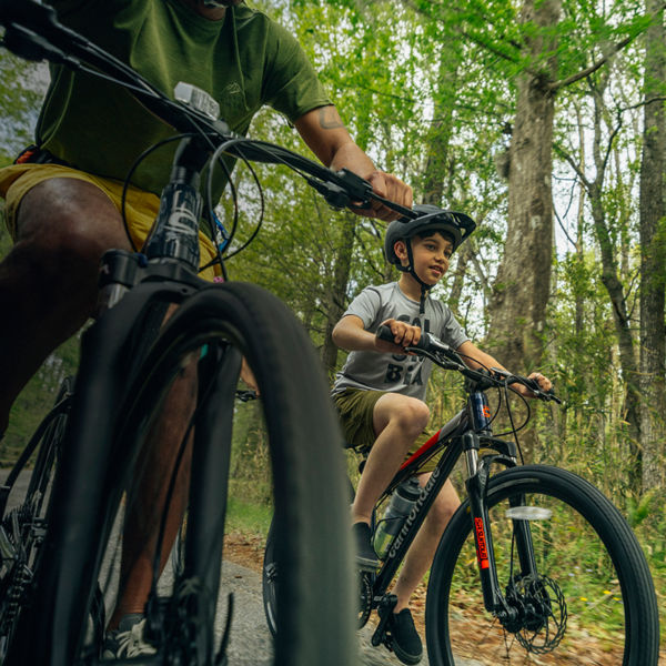 A father and son mountain biking