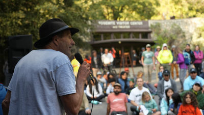 Ken Yager speaking in front of a crowd