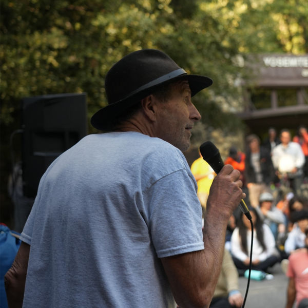 Ken Yager speaking in front of a crowd
