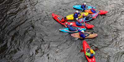 Group of kayakers guided by a professional guide 