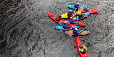 Group of kayakers guided by a professional guide 