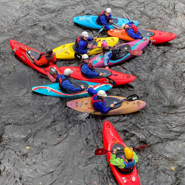 Group of kayakers guided by a professional guide 