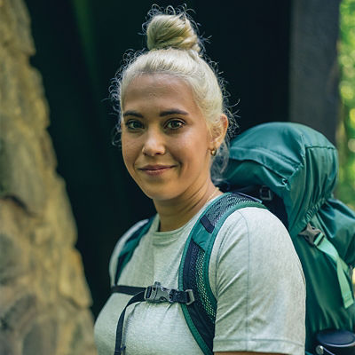 Female hiker wearing a backpacking pack