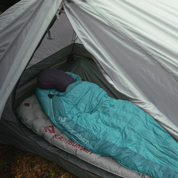 A sleeping bag in a tent