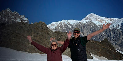 Grandma Joy and Brad Ryan pose in front of mountains