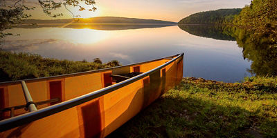 sunrise on the lake by the canoe in the boundary waters of Minnesota