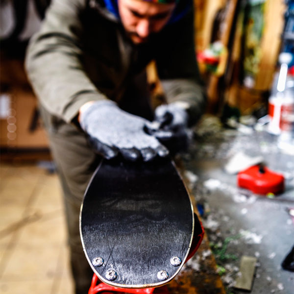 Waxing skis in a workshop