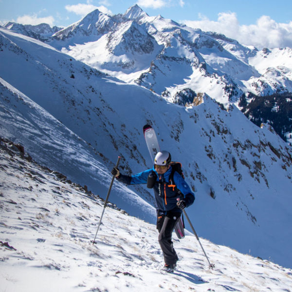 Aidan Goldie walks up a mountain