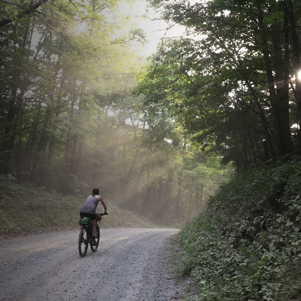 A woman rides a bike on the bull and jake trail in N Georgia  