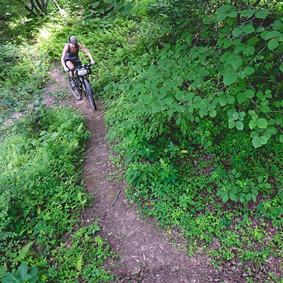 A woman biking the bull and jake trail in N Georgia