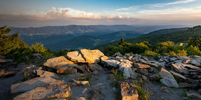 A dramatic sunset viewed from Spruce Knob West Virginia in the Appalachian Mountains looking down on hills in the surrounding valleys