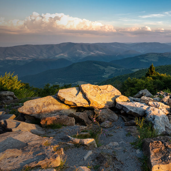 A dramatic sunset viewed from Spruce Knob West Virginia in the Appalachian Mountains looking down on hills in the surrounding valleys