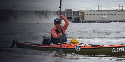 The Grand Salmon women pose with their kayaks 