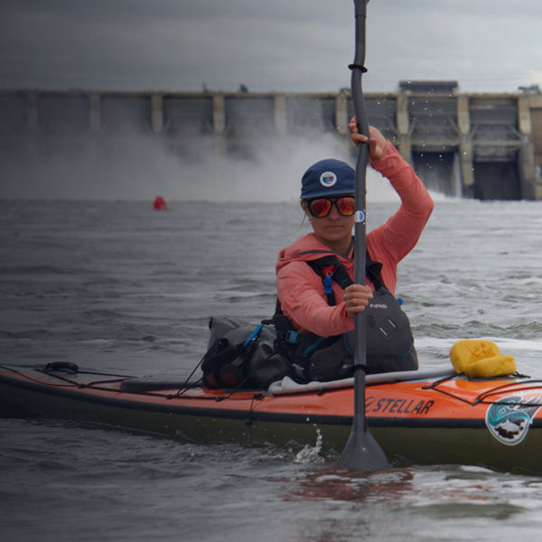 The Grand Salmon women pose with their kayaks 