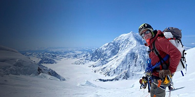 Josh Jespersen poses for the camera out in the snowy mountains 