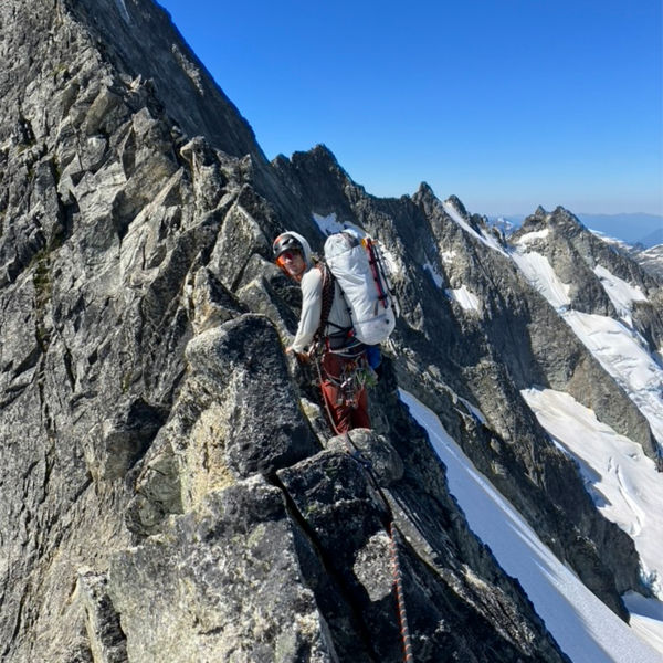 Josh Jespersen climbs a mountain in the snow