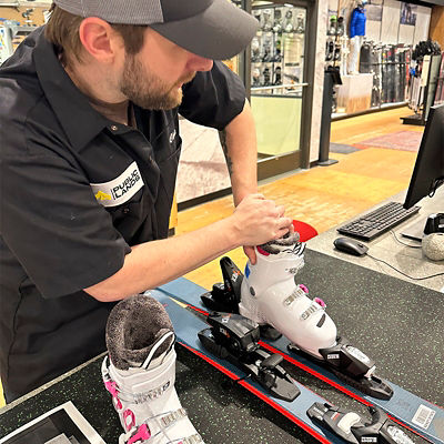 Public Lands staff adjusts ski boots and binding